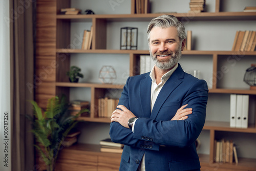 Confident bearded man psychotherapist in stylish suit posing