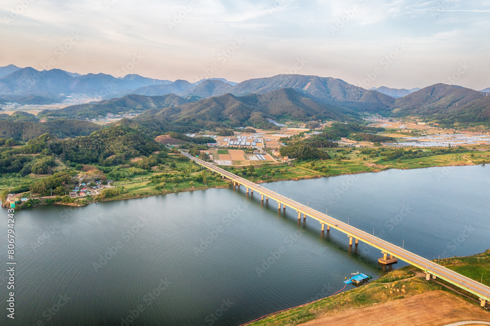 aero drone view. Green Barley Field Scenery of Nakdonggang River in Korea.
