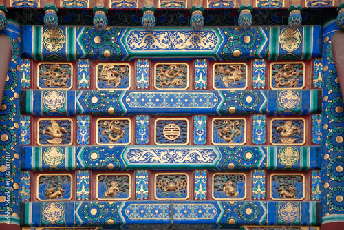 The background image is a fragment of the wall of an ancient Chinese temple with traditional patterns