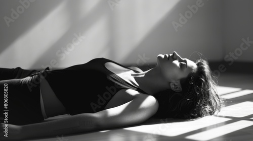 Woman Laying on Floor in Black and White