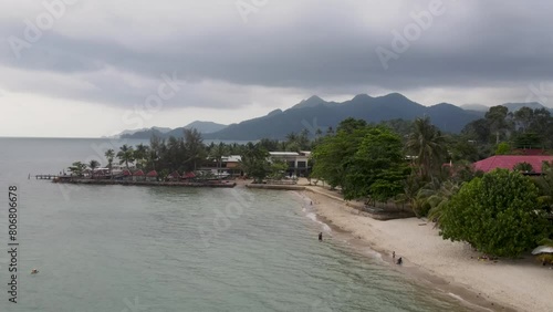 Aerial View Along Kai Bae Beach Coastline With Tropical Forest Landscape In Background. Push Forward Shot photo
