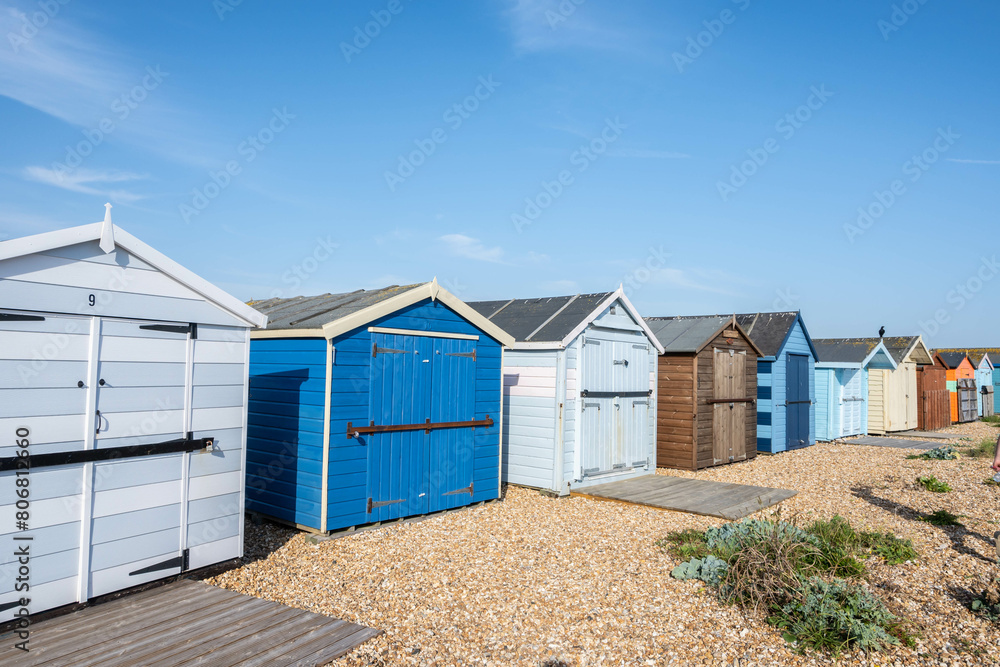 Colourful beach huts during summer on Hayling Island in England Colourful beach huts during summer on Hayling Island in England