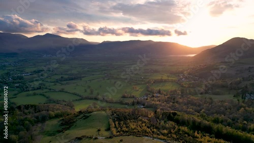 4k footage of the sunrise behind the hills overlooking Keswick in Cumbria, UK photo