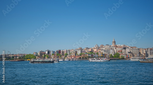 Touristic sightseeing ships in Golden Horn bay against blue sky and clouds. Istanbul, Turkey. During sunny summer day. © eskstock