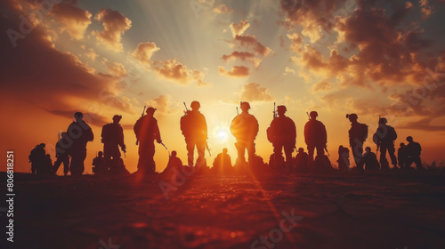 Dramatic silhouette of a group of soldiers at sunset  depicting a powerful scene of camaraderie and mission.