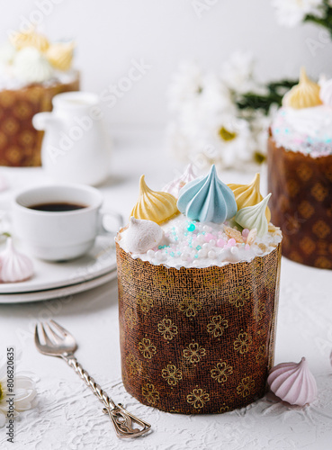 Delicate easter kulich cake with colorful icing