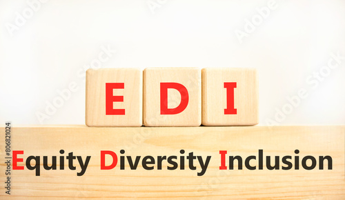 EDI equity diversity inclusion symbol. Concept words EDI equity diversity inclusion on wooden blocks. Beautiful white background. Business EDI equity diversity inclusion concept. Copy space.