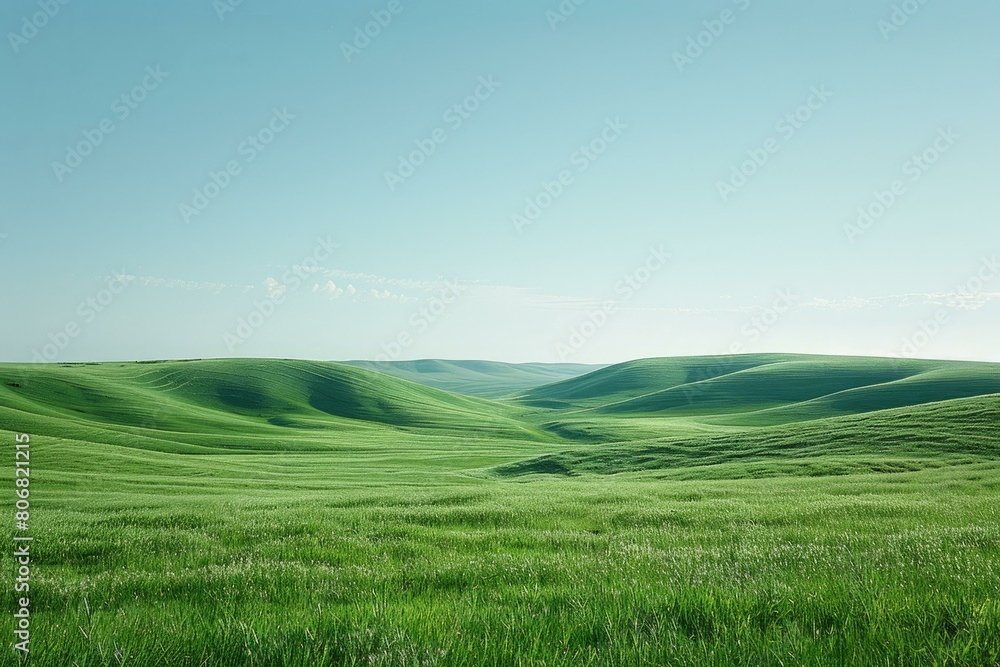 Green rolling hills under clear blue sky