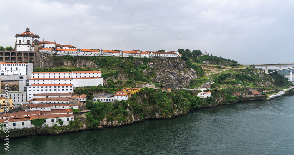 Obraz premium View of Porto Cathedral or Se Catedral built in 12th century and terracotta roofs of the Ribeira and Vila Nova de Gaia. Historic building in old town Porto, Portugal.