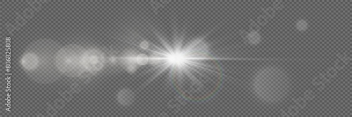 Flash light effect. A bright star with a glare of light. Explosion of rays and dust particles. On a transparent background.