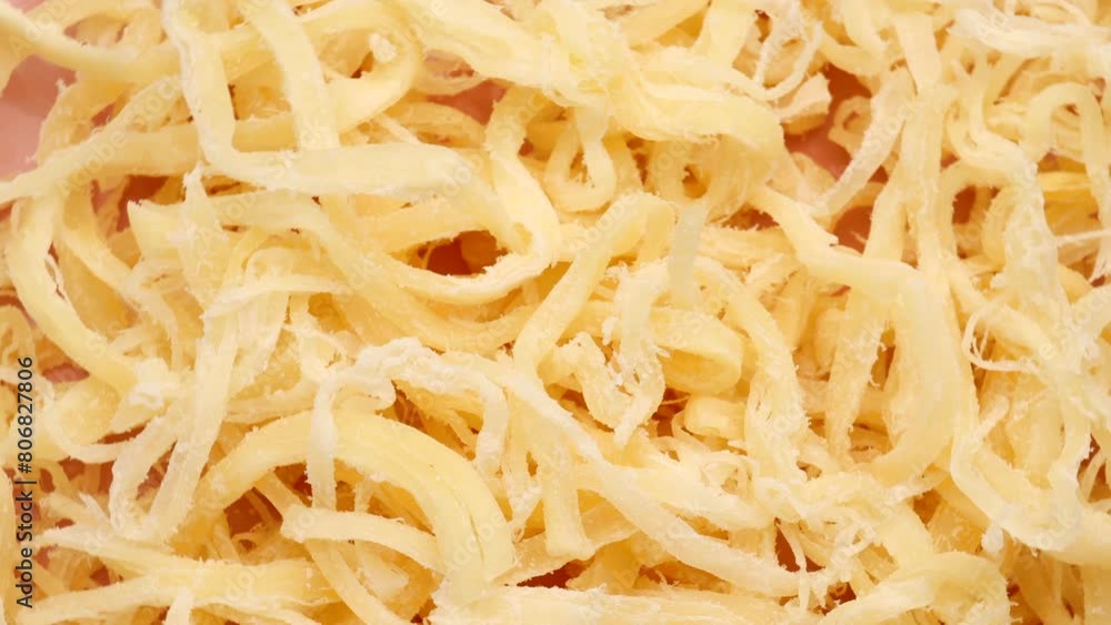 dried squid, rotation in circle. Delicious dried squid in the form of shavings with salt, Turning. selective focus dried squid, rotation in circle. Delicious dried squid in the form of shavings with salt, Turning. selective focus