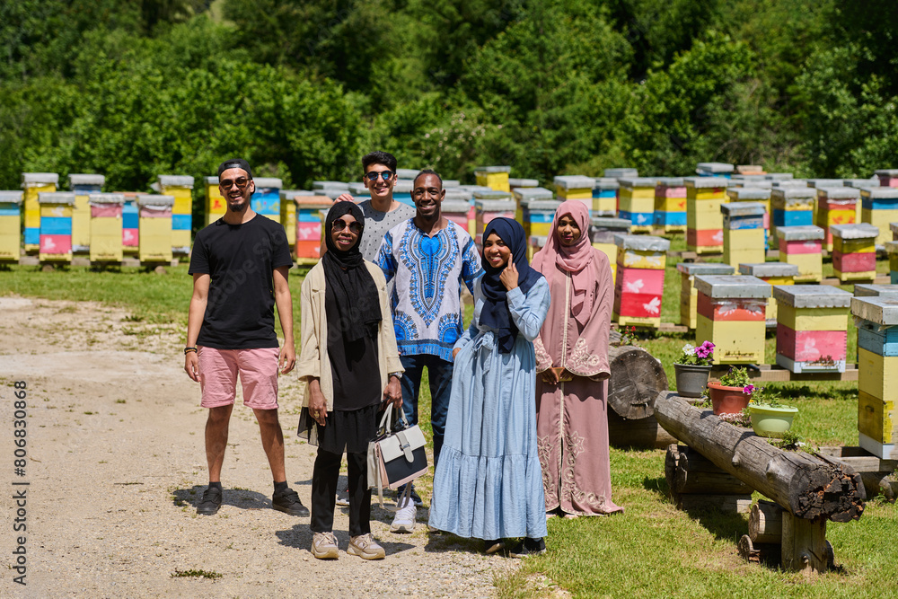A diverse group of young friends and entrepreneurs explore small honey production businesses in the natural setting of the countryside.