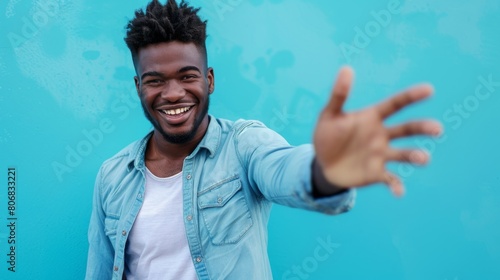 Cheerful Man with Outstretched Hand photo