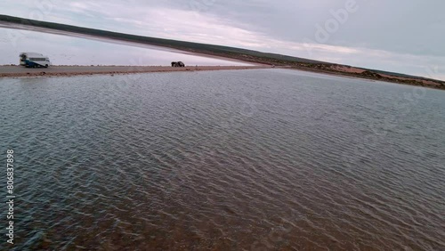 Recreational Vehicle Driving On Road At Lake Macdonnell On Eyre Peninsula, South Australia. slow FPV drone photo