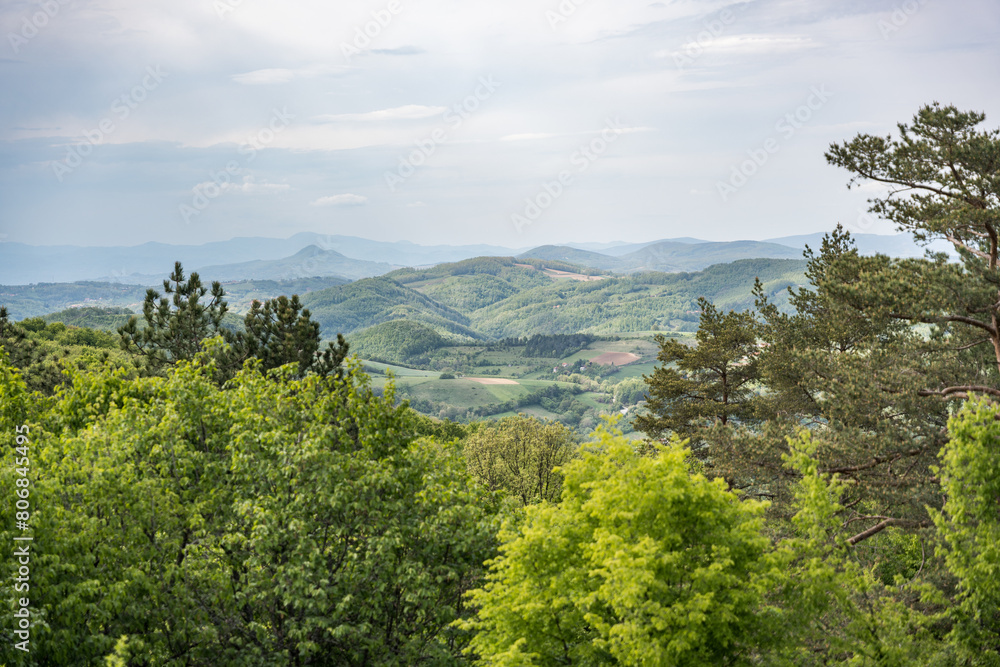 Fototapeta premium Ovcar and Kablar mountains new West Morava river in Serbia, view of natural park, rocks, trees and fields of grass. Protected Serbian natural park.