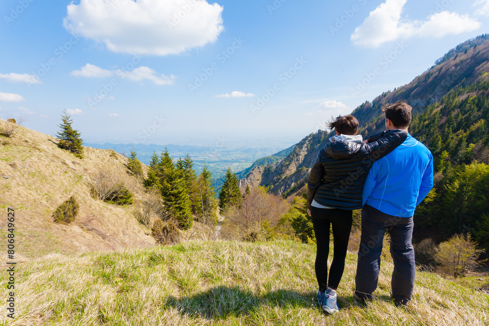 Young couple on top of a mountain