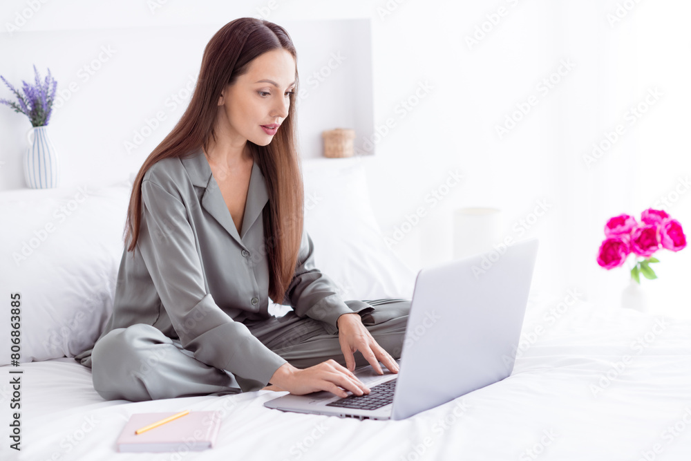 Photo of shiny positive lady grey sleepwear enjoy morning chatting modern gadget indoors home bedroom Photo of shiny positive lady grey sleepwear enjoy morning chatting modern gadget indoors home bedroom