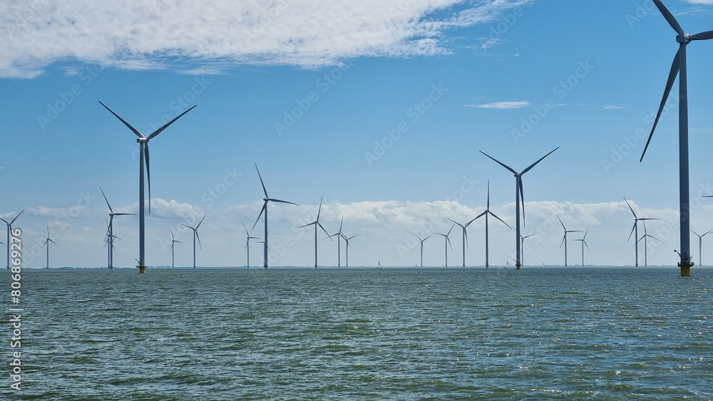 Row of wind turbines in the ocean Row of wind turbines in the ocean