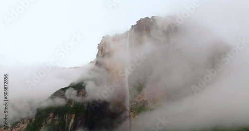 Morning Clouds Reveal Angel Falls Over Steep Mountains In Bolivar State, Southeastern Venezuela. Aerial Shot photo