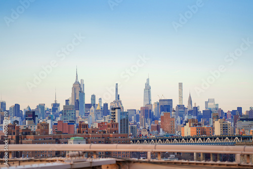 Panorama view of New York city and Brooklyn bridge at sunset.