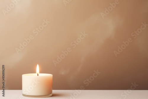 Beige background with white thin wax candle with a small lit flame for funeral grief death dead sad emotion with copy space texture for display 