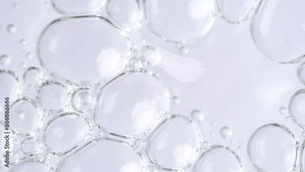 Motion of molecule bubbles in a cosmetic serum, macro. Transparent cosmetic gel fluid with molecule bubbles. Macro shot of natural organic cosmetics, health care , medicine. Slow Motion Motion of molecule bubbles in a cosmetic serum, macro. Transparent cosmetic gel fluid with molecule bubbles. Macro shot of natural organic cosmetics, health care , medicine. Slow Motion