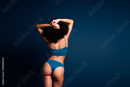 No filter photo of gorgeous stunning lady underwear standing back accept imperfect skin empty space isolated blue color background © deagreez
