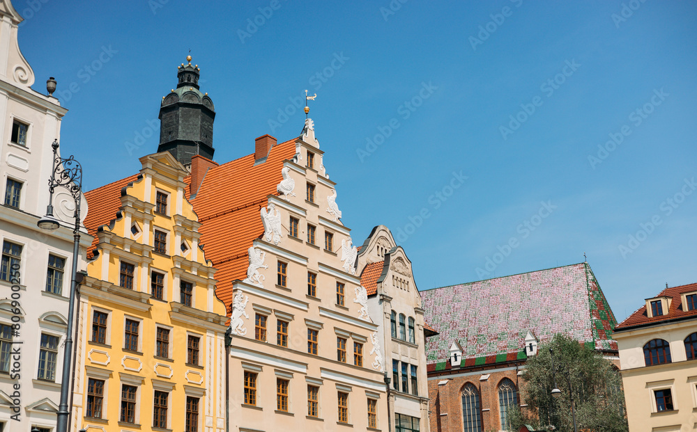 Beautiful colorful facades of antique building at Wroclaw, Poland. Polish landmark in the historic center of town. Clear blue sky