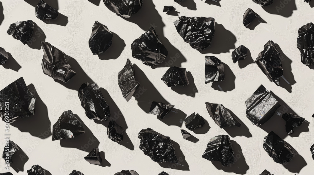 coal pieces scattered on a plain background with subtle shadows, representing the use of coal as a fossil fuel coal pieces scattered on a plain background with subtle shadows, representing the use of coal as a fossil fuel