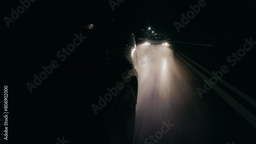Traffic Patrol Car in Pursuit. Police Officers in Squad Car Chasing Suspect on night Road, Sirens Blazing, High Speed. Cops on Emergency Response Call. Stylish Cinematic Action Packed Shot