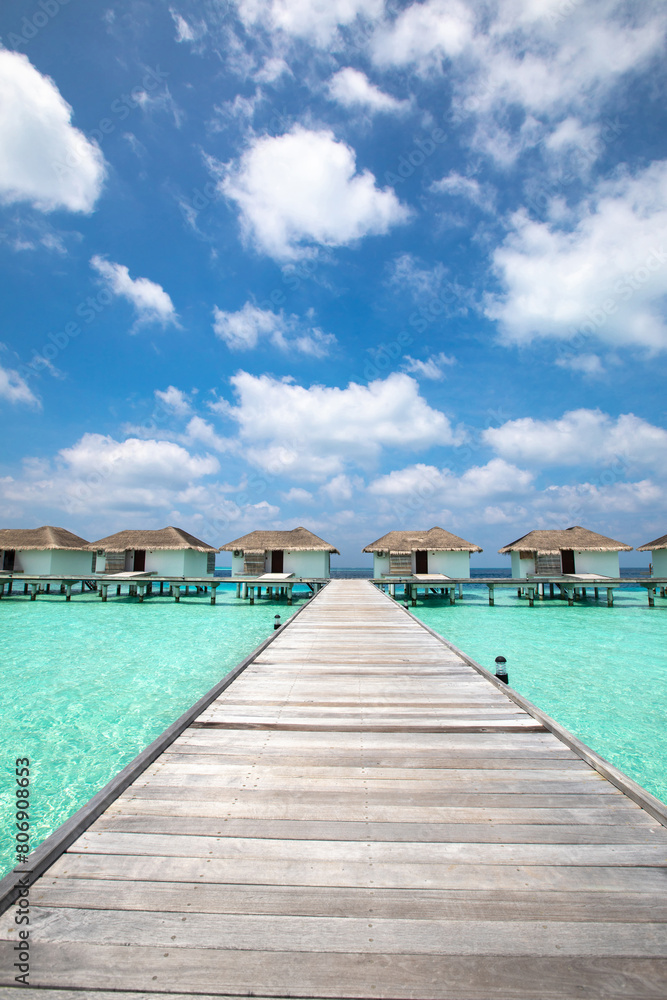 luxury hotel resort in Maldives, wooden pier over turquoise water beach, paradise holiday destination