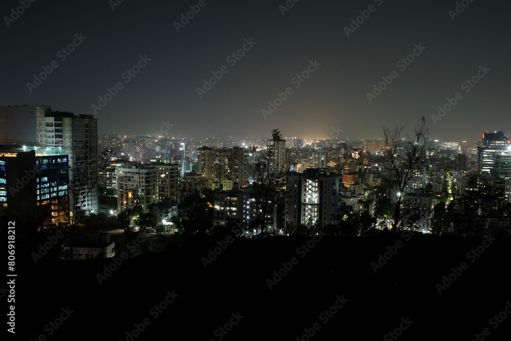 Obraz premium View of Pune in summer, Cityscape Skyline, buildings holdings, Signboards, and banners, Pune, Maharashtra, India