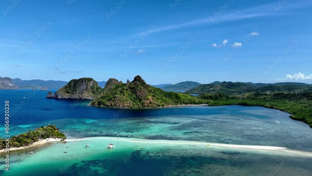 Aerail view of tropical exotic island sand bar separating sea in two with turquoise in El Nido, Palawan, Philippines. Aerail view of tropical exotic island sand bar separating sea in two with turquoise in El Nido, Palawan, Philippines.