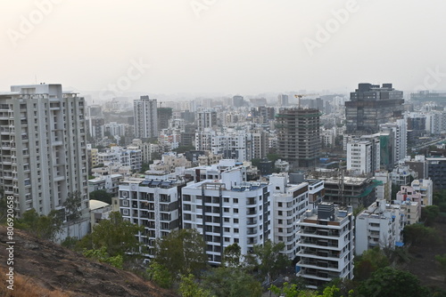 View of Pune in summer, Cityscape Skyline, buildings holdings, Signboards, and banners, Pune, Maharashtra, India