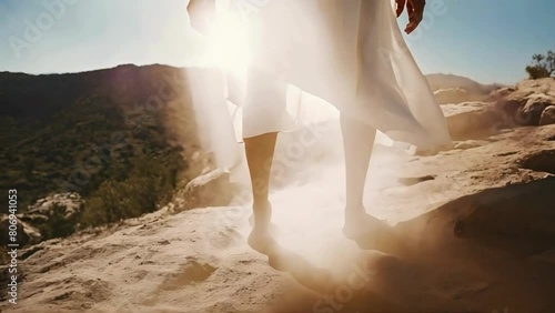 Divine Presence: Jesus Christ or a Biblical Prophet Walking on Rocky Wilderness Terrain in White Tunic   Without Sleepers
