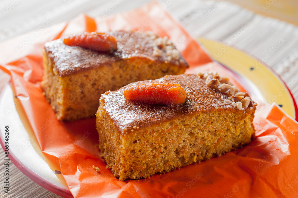 Two portions of carrot and pumpkin cake with nuts Two portions of carrot and pumpkin cake with nuts