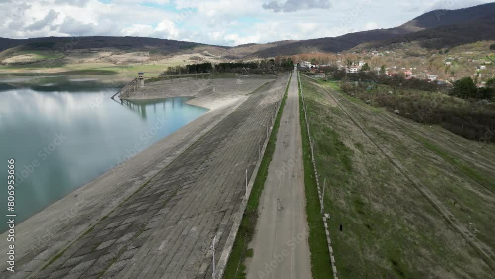 flying over a lake dam in the mountains, aerial view, camera moving forward flying over a lake dam in the mountains, aerial view, camera moving forward