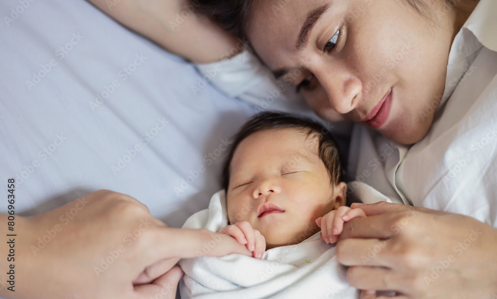 Close up portrait of beautiful young asian caucasian mother day girl kissing healthy newborn baby sleep in bed with copy space. Healthcare and medical love asia woman lifestyle mother's day banner Close up portrait of beautiful young asian caucasian mother day girl kissing healthy newborn baby sleep in bed with copy space. Healthcare and medical love asia woman lifestyle mother's day banner