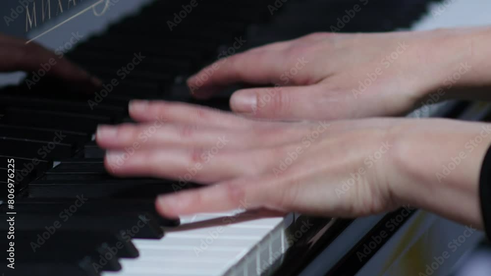Pianist performing in orchestra. Close up hands of pianist playing. Pianist performing in orchestra. Close up hands of pianist playing.