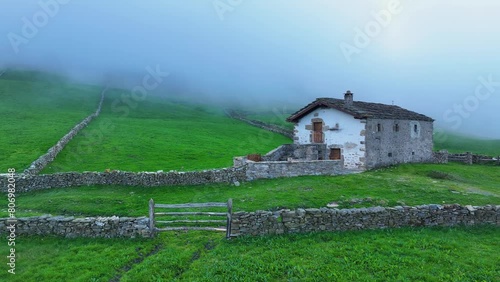 Landscape of meadows, pasiegas cabins around Portillo de la Sía in the area around the town of La Gándara in the Soba Valley. Pasiegos Valleys. Cantabria. Spain. Europe photo