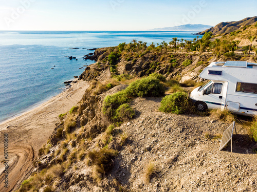 Caravan camping on sea shore, Spain. © Voyagerix