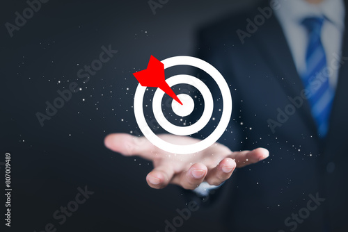 Target concept with Businessman hand holding target icon.