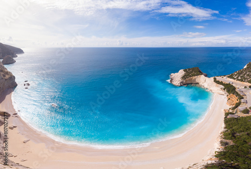 Aerial beautiful beach and water bay in the greek spectacular coast line. Turquoise blue transparent water, unique rocky cliffs, Greece summer top travel destination Lefkada island