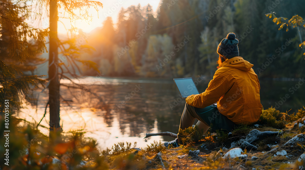 Serene Remote Work Setup: A Realistic Image of a Worker Using a Laptop by a Tranquil Lakeside, Blending Work with Nature Serene Remote Work Setup: A Realistic Image of a Worker Using a Laptop by a Tranquil Lakeside, Blending Work with Nature