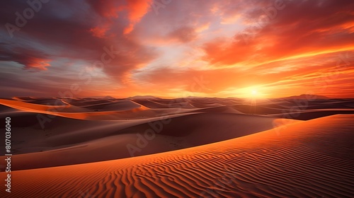Panoramic view of sand dunes in the desert at sunset © Michelle