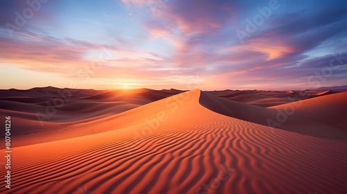 Sunset over the sand dunes of the Sahara desert in Morocco © Michelle