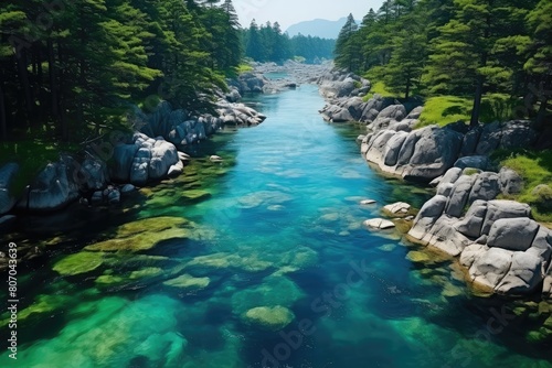 Japan landscape. Tranquil Turquoise River Flowing Through Verdant Forest.
