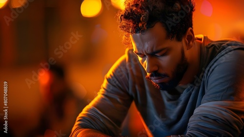 Depressed man at support group for mental health and addiction issues. Concept Mental Health, Support Groups, Depression, Addiction, coping strategies photo