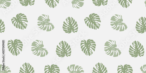 Summer vector seamless pattern with green monstera leaves on a white background. Tropical print for textiles, wrapping paper, wallpaper, cover or case design.
