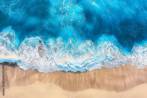 Coast with waves as a background from top view. Blue water background . Summer seascape from air. Travel image 